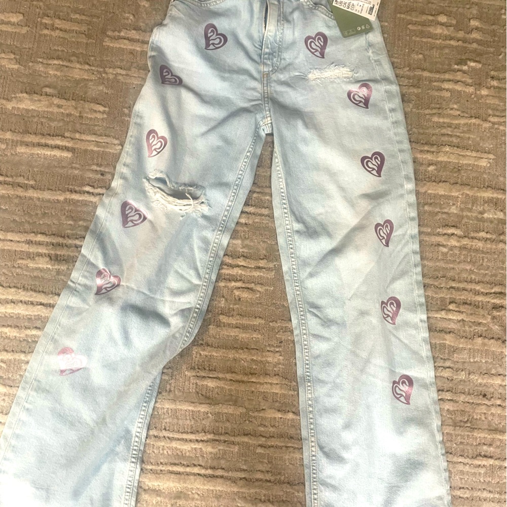H&M Jeans.Size 14 girls but fits small woman. Blue w/pink chrome hearts